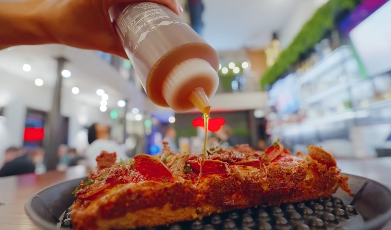 Drizzled honey adds a sweet touch to a savory pizza