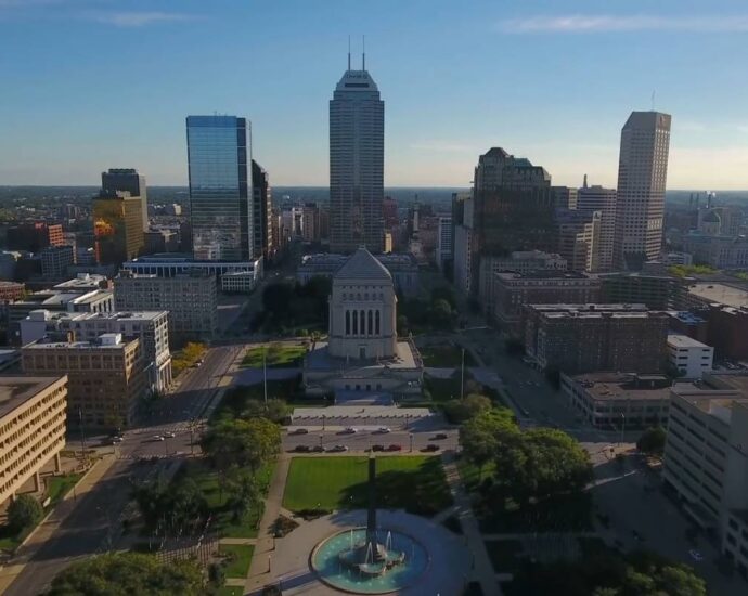 Downtown Indianapolis skyline with monument and surrounding high rise buildings