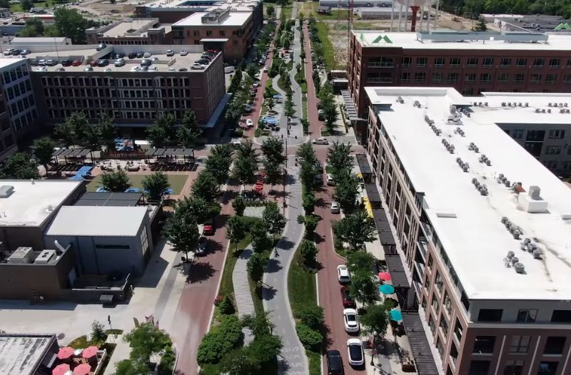 Aerial view of downtown Carmel with landscaped boulevard and mixed-use buildings