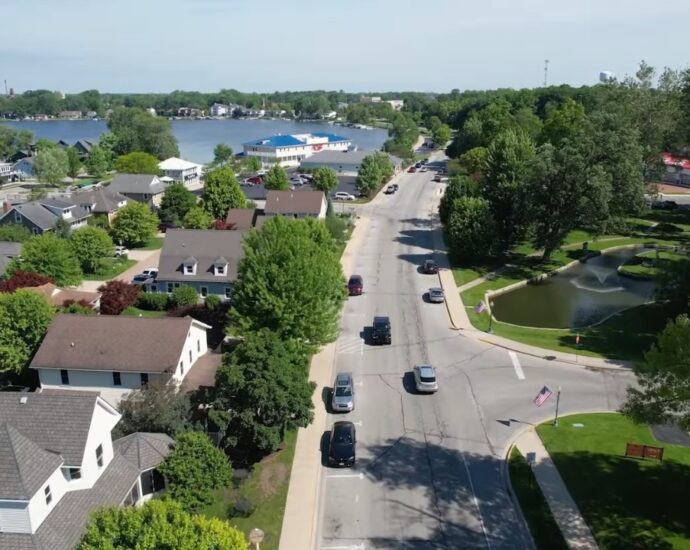 A quiet Indiana lake town with homes, trees, and local streets near the water