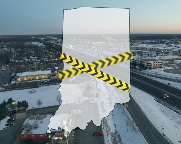 Map outline of Indiana over a cityscape with caution tape symbolizing crime awareness