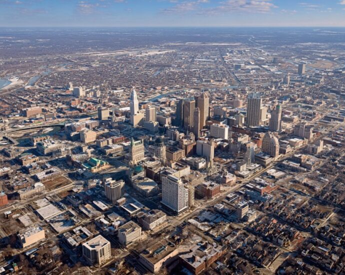Aerial view of downtown Indianapolis with city buildings and surrounding neighborhoods
