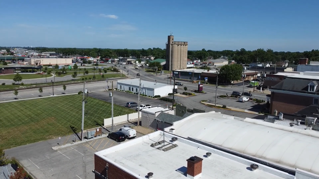 Aerial view of Seymour with local roads, business buildings, and open town blocks