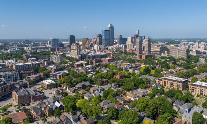 Aerial view of a cityscape with tall skyscrapers in the background