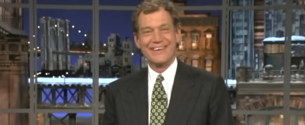 David Letterman smiles on a studio set