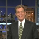 David Letterman smiles on a studio set