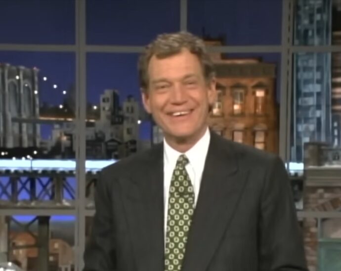 David Letterman smiles on a studio set