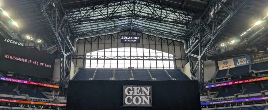 Gen Con banners and tabletop booths inside Lucas Oil Stadium in Indianapolis