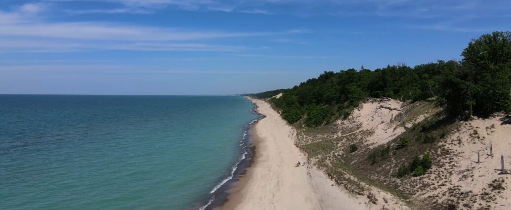 A sandy Indiana Dunes beach stretches beside Lake Michigan