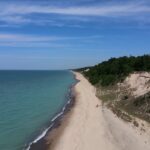 A sandy Indiana Dunes beach stretches beside Lake Michigan