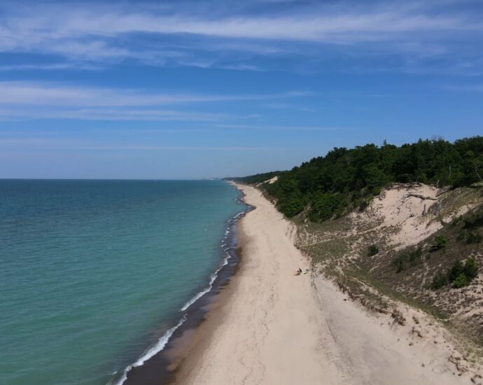 A sandy Indiana Dunes beach stretches beside Lake Michigan