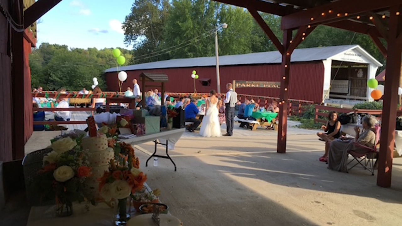 Guests gather near Mansfield Covered Bridge for an outdoor wedding in Parke County