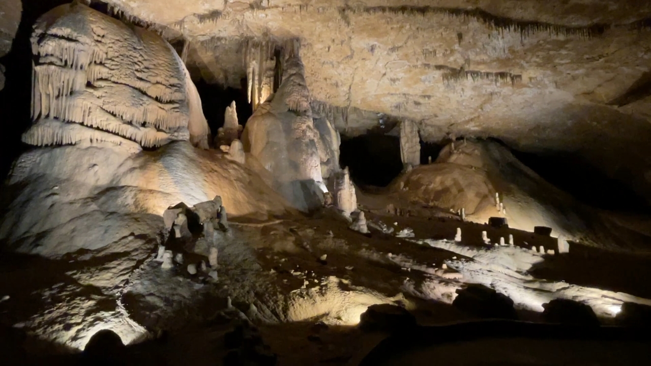 Marengo Cave chamber with stalactites and lit mineral walls