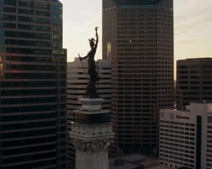 Downtown Indianapolis skyline and the Soldiers and Sailors Monument at sunset