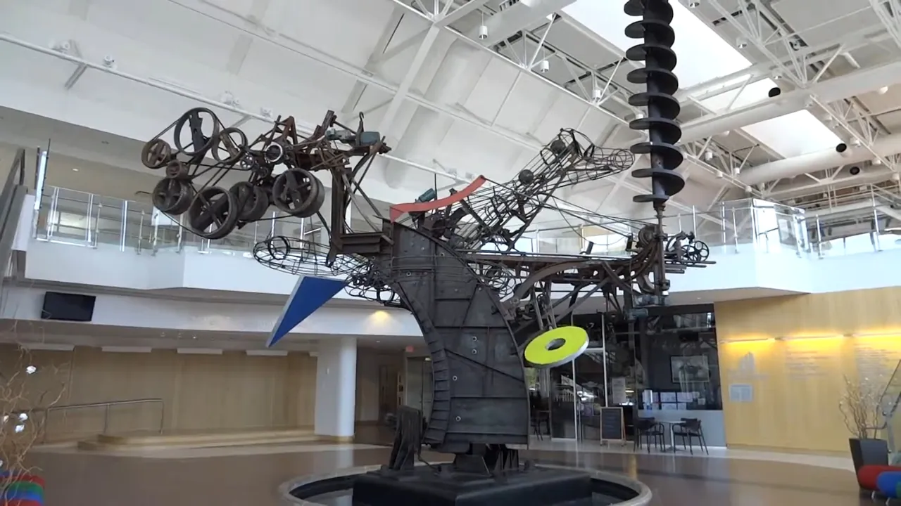 Jean Tinguely’s Chaos I sculpture fills the bright atrium inside The Commons in Columbus, Indiana