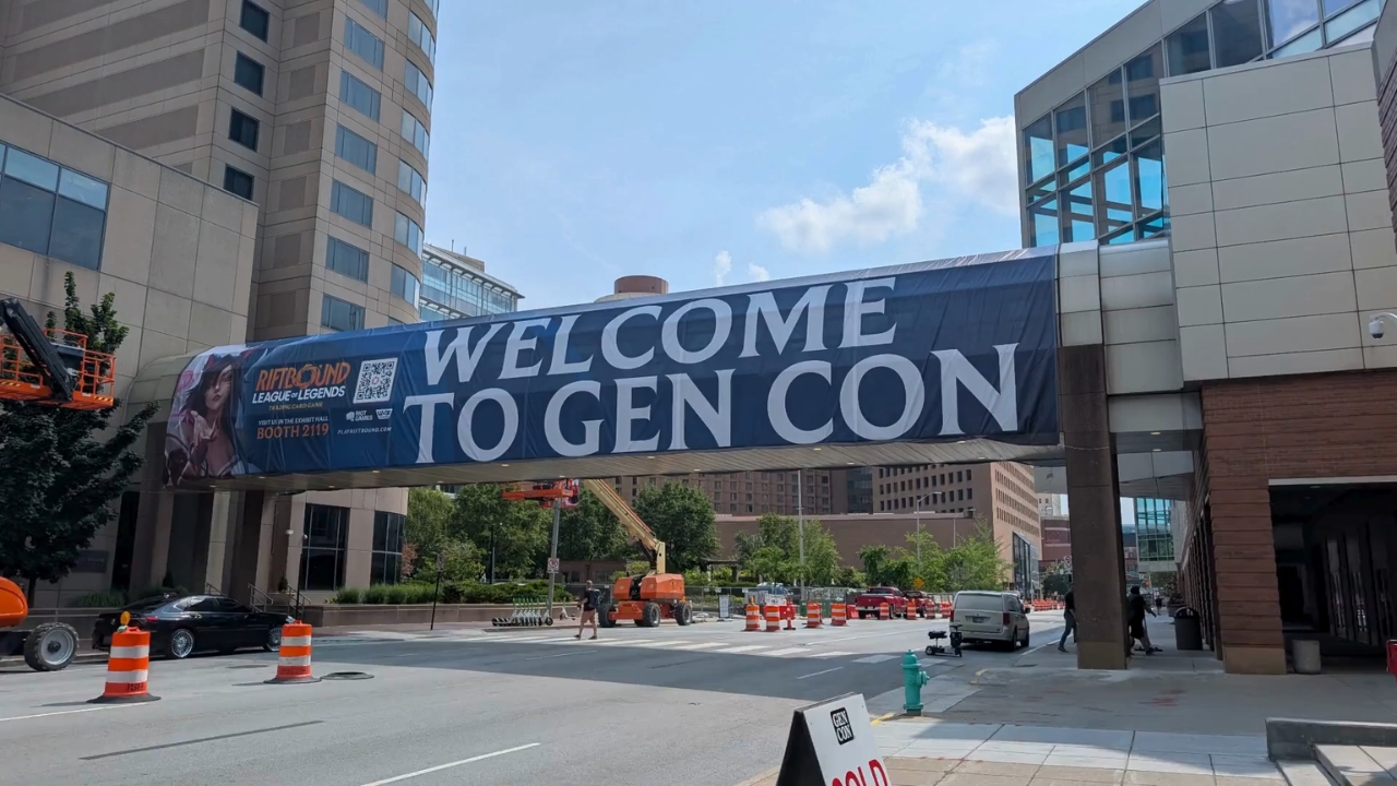 A large Welcome to Gen Con banner spans a downtown Indianapolis street