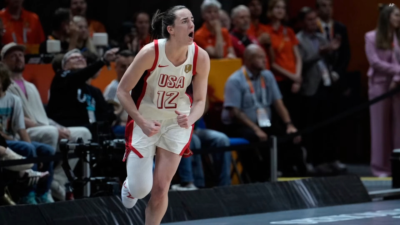 Caitlin Clark reacts during a game on the court
